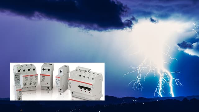 Kirkas salama tummansinistä taivasta vasten alakulmassa kuva abb:n OVR-ylijännitesuojista.